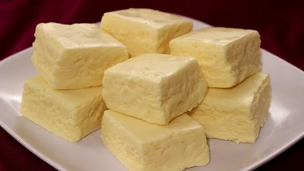 Stacked banana fudge on a white plate.