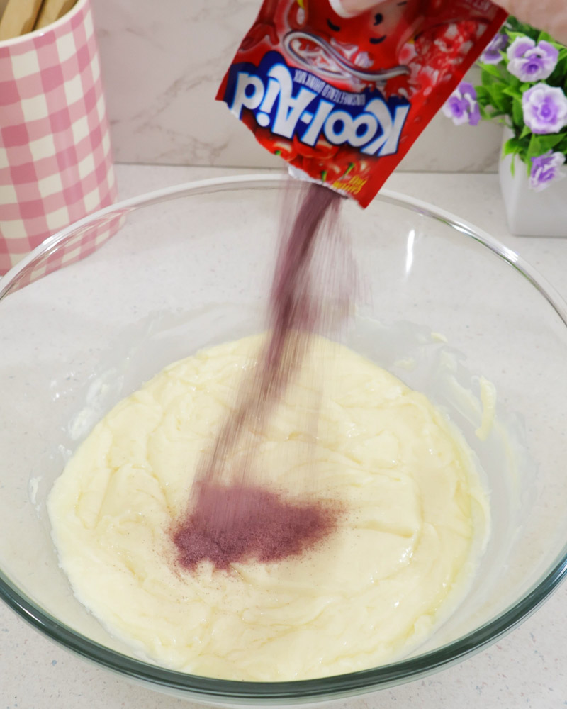 Packet of cherry flavored Kool-Aid added to the melted mixture