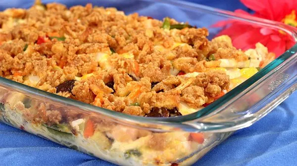 Glass baking dish fresh from the oven loaded with chicken and vegetables.