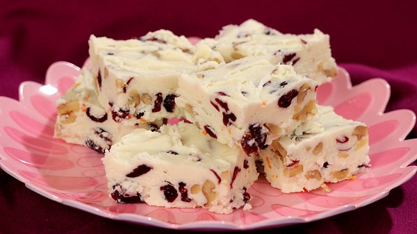 This festive white fudge is made with dried cranberries and chopped walnuts.  Delicious and pretty for your holiday table!