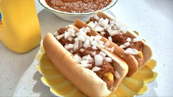 Hot dogs topped with Greek-style sauce that is loaded with spices