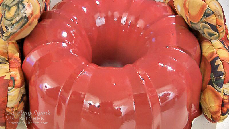 Grabbing both sides, carefully flip the plate and pan over.