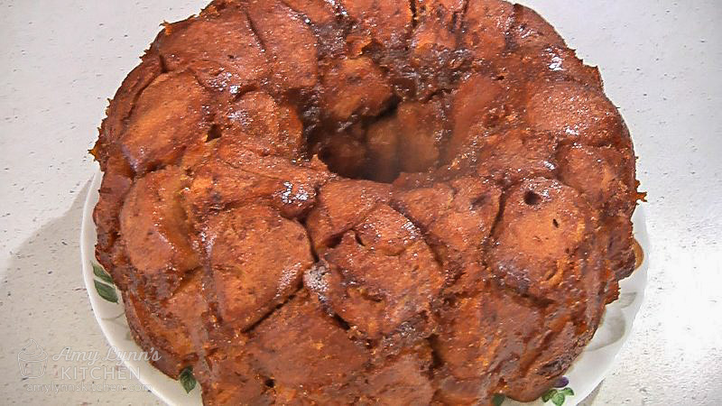 Using a plate over the pan, flip it over and remove pan from the monkey bread.