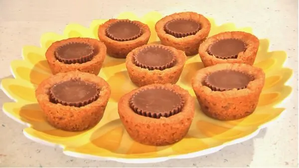 Reese Cup cookies on a yellow plate.
