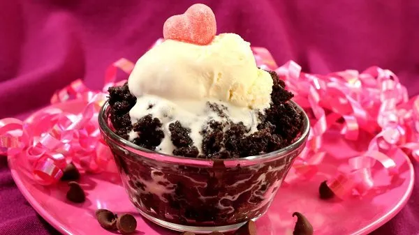 Bowl of slow cooker chocolate pumpkin spoon cake.